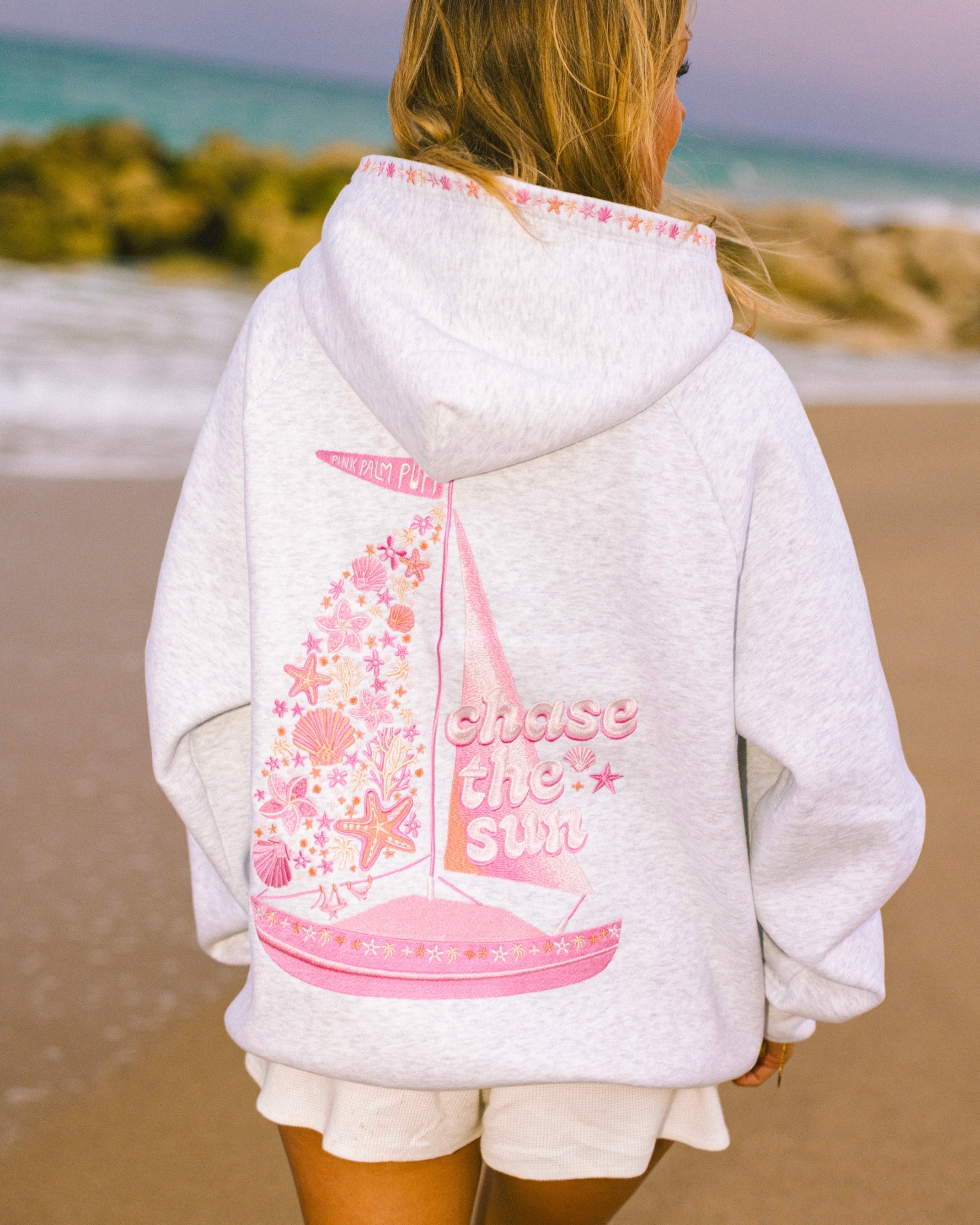 "Chase the Sun" Relaxed Hoodie, relaxed fit with an adjustable drawstring hood and pocket, in Heather Cloud - coastal preppy aesthetic beach style by Pink Palm Puff