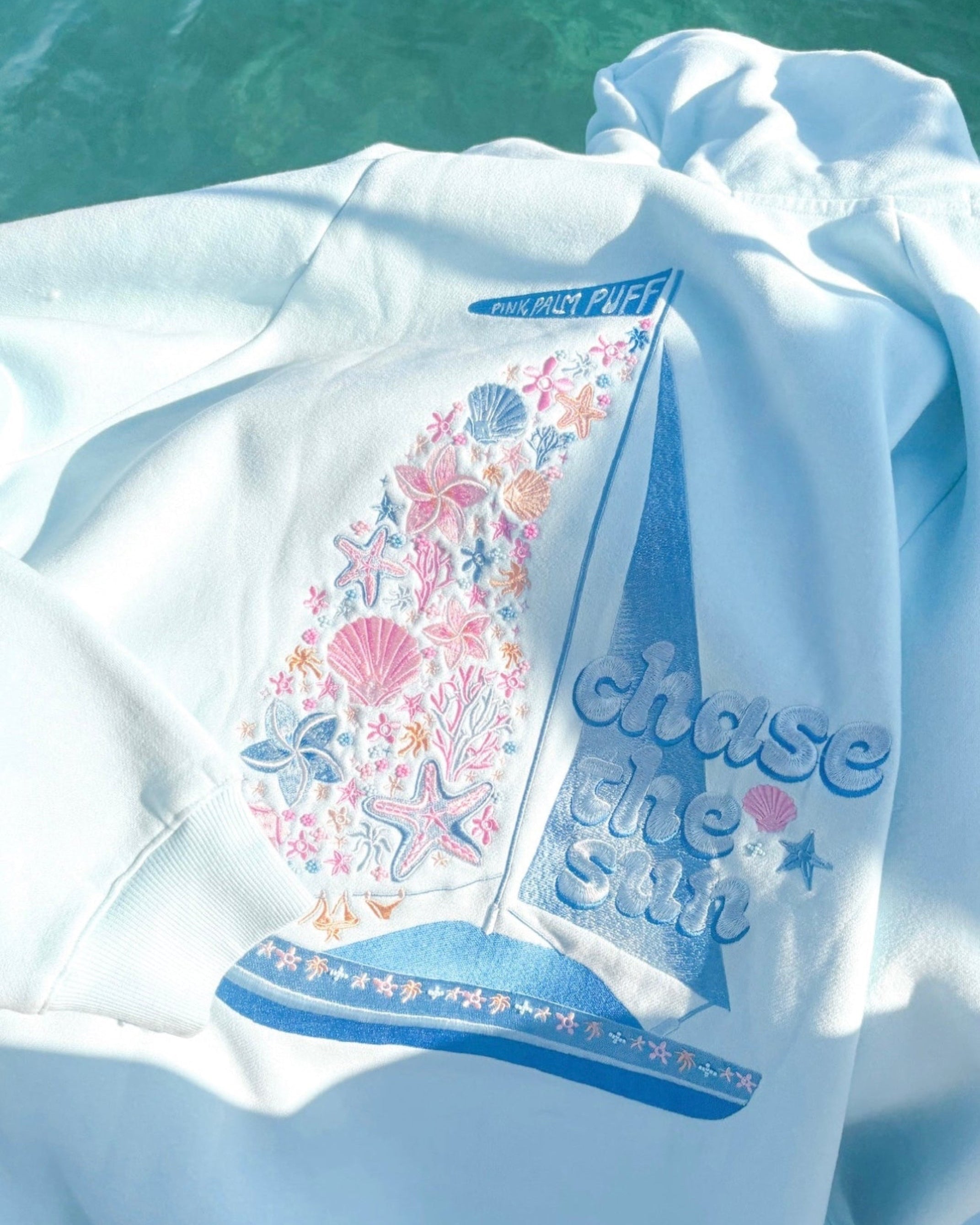"Chase the Sun" Relaxed Hoodie, relaxed fit with an adjustable drawstring hood and pocket, in Sky Blue - coastal preppy aesthetic beach style by Pink Palm Puff